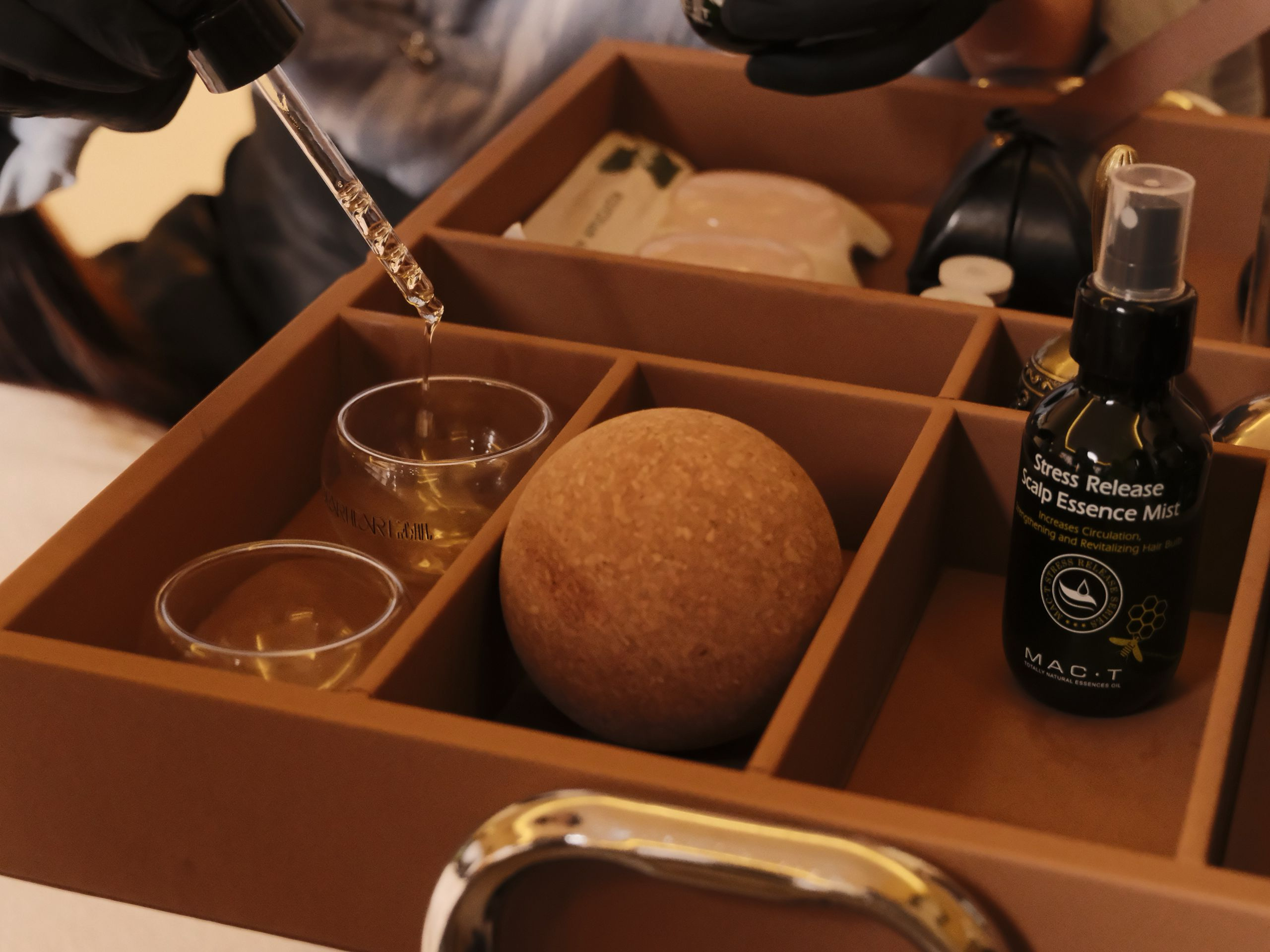 Aromatherapy oils and scalp essence prepared for luxury head spa treatment in Bellevue