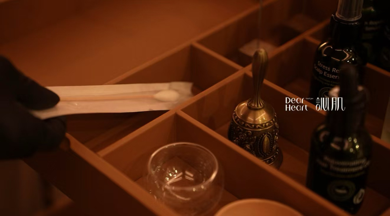 Organic scalp care products and tools displayed in spa treatment tray